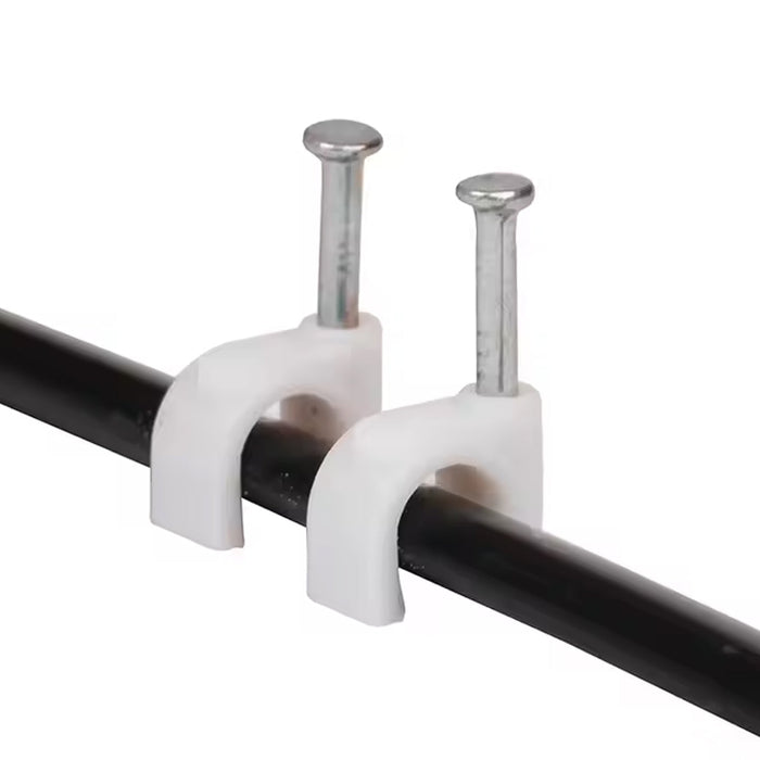 Close-up of plastic U-shaped 8mm nail cable clips with steel nails