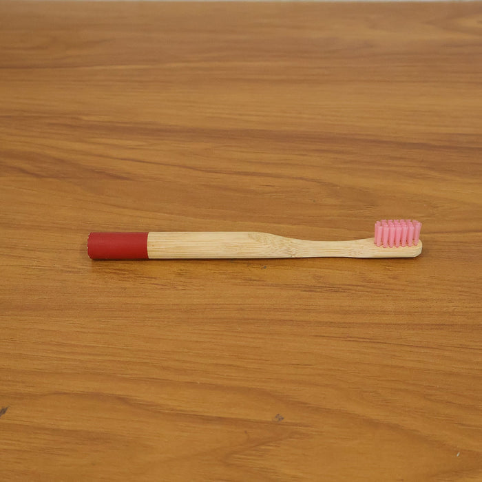 Lifestyle image of bamboo toothbrush in bathroom setting