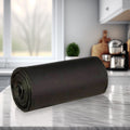 A roll of black garbage bags with a tie-tape for easy and hygienic waste disposal.