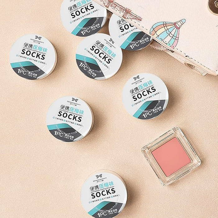 Disposable travel socks displayed to show their lightweight and thin design.
