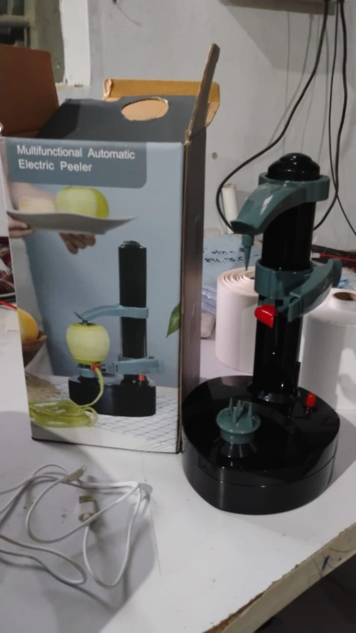 Electric peeler securely holding and peeling a potato automatically