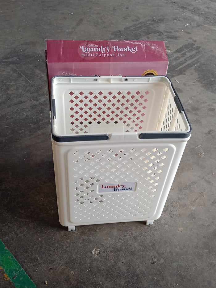 Foldable laundry basket being used to carry laundry with wheels