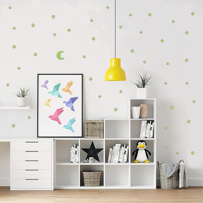 Fluorescent star and moon stickers glowing brightly at night, bringing the wonders of the cosmos indoors.
