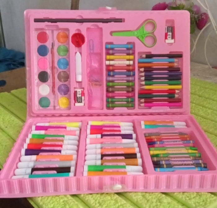 Child sketching with color pencils from the Craftily drawing supplies set.