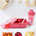 A vibrant yellow leak-proof lunch box with a matching water bottle and fork, ready for a meal.