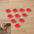 Red lips shape keychain attached to a handbag, stylish accessory