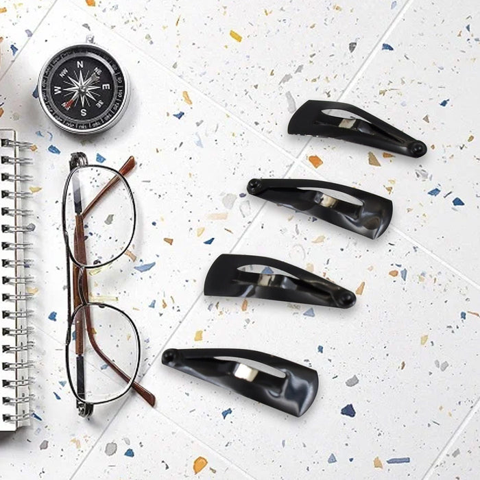 Matt black Metal Tic Tac Hair Clips on a neutral background, showcasing their sleek design.