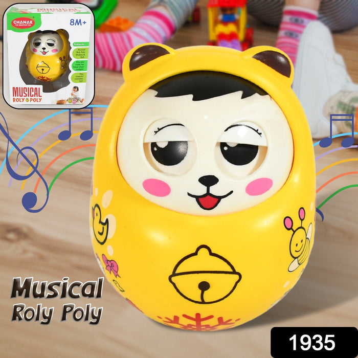 Happy baby playing with the wobbling musical roly poly toy on a mat