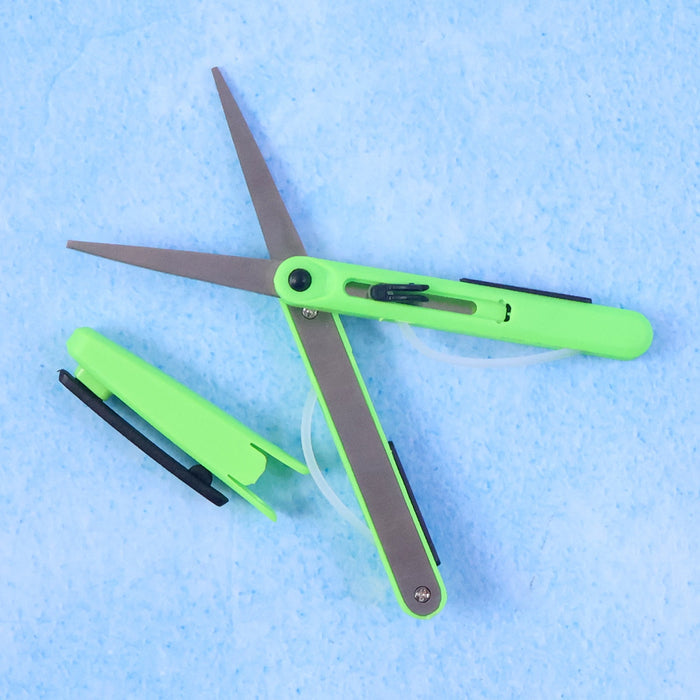 Detail of the retractable handle mechanism on the portable pen scissors.