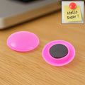 Pink 30mm circular plastic board magnet button on white background