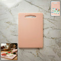 Plastic chopping board with handle grip on kitchen counter