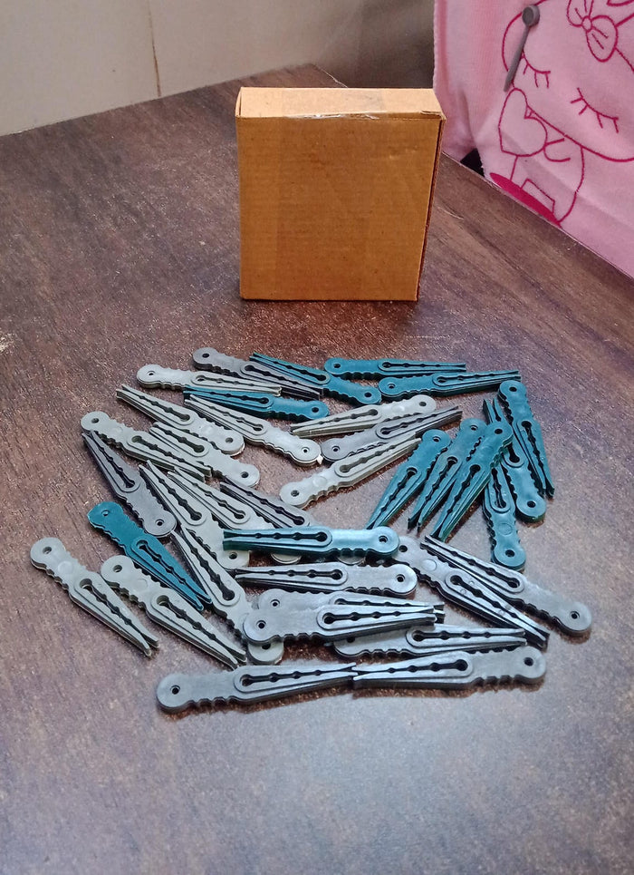 An image illustrating the compact size and easy storage of the 36 Pcs plastic cloth pegs.