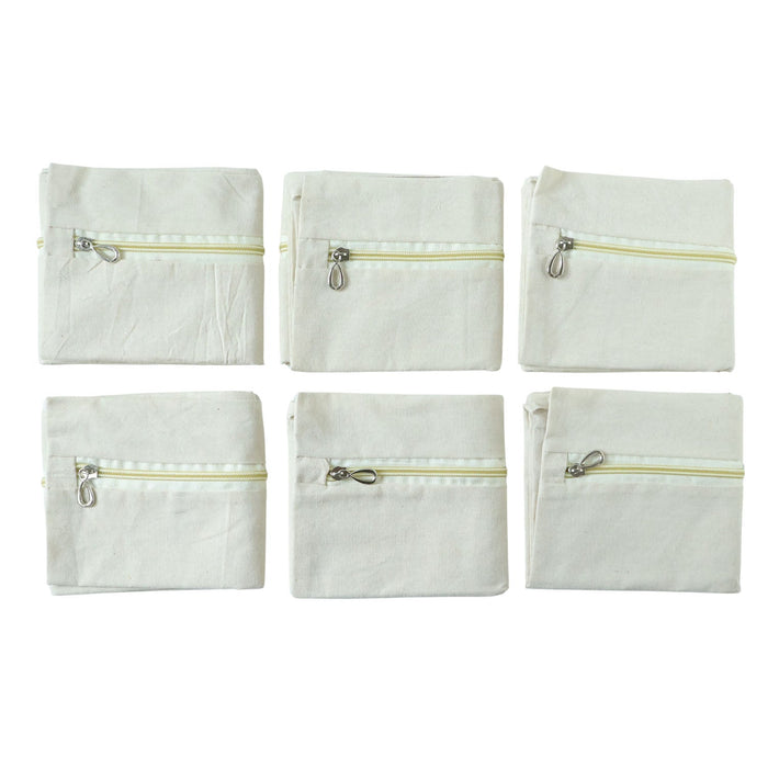 Six saree storage zipper pouches arranged for wardrobe organization