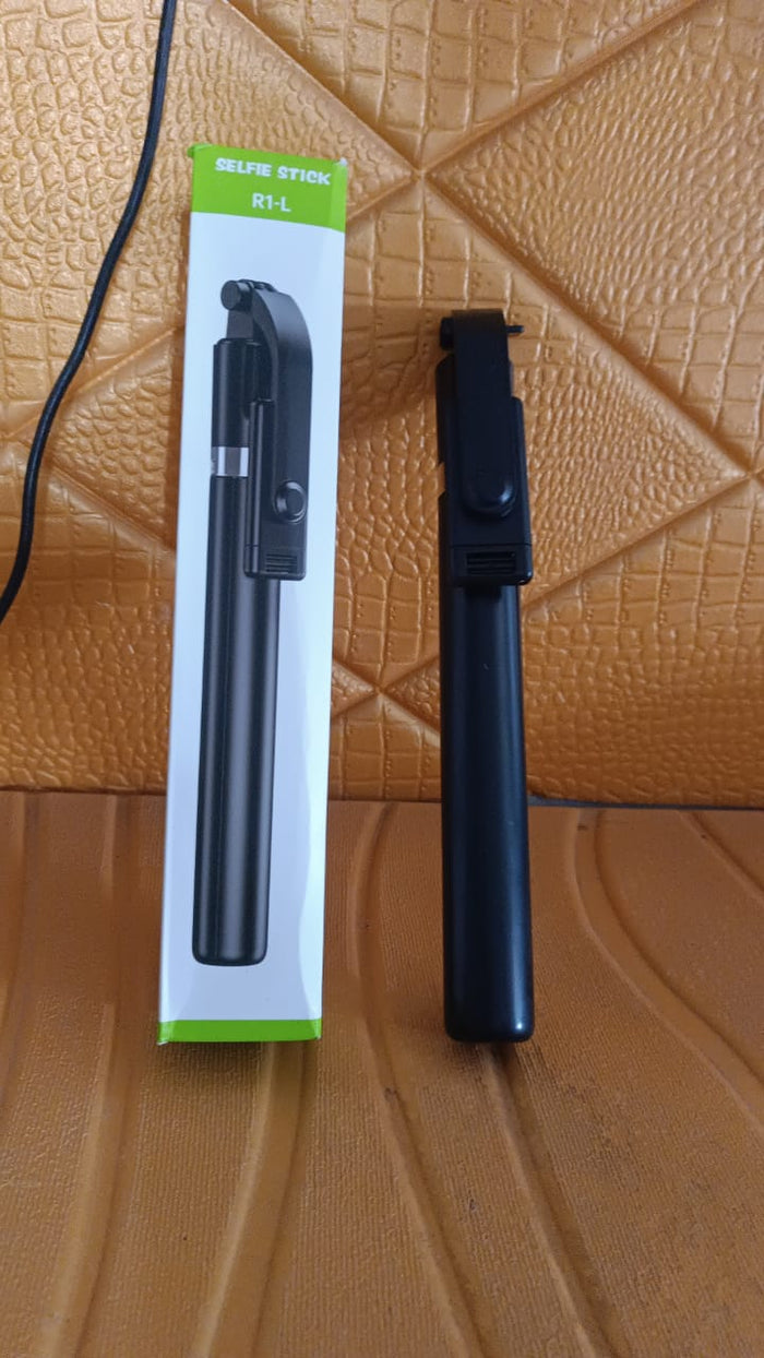 Folded selfie stick with phone holder and Bluetooth remote for travel