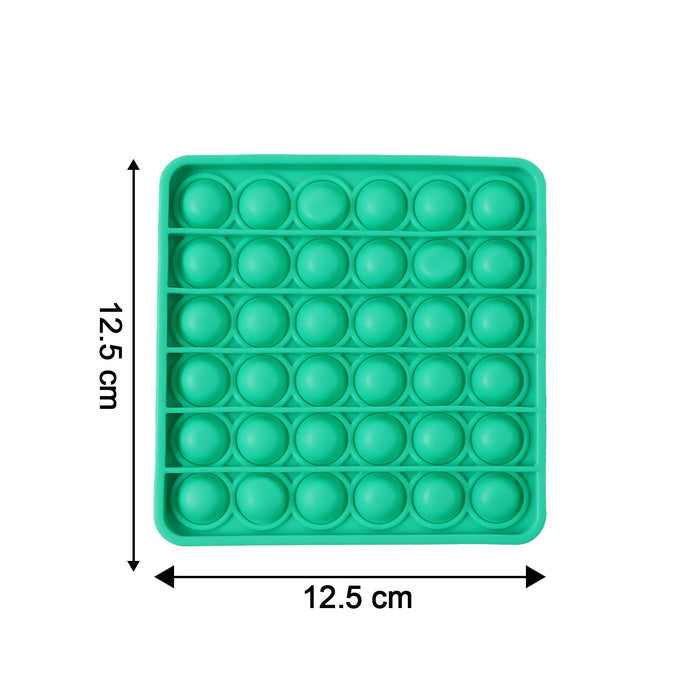 Close-up of popping bubbles on silicone Pop It toy