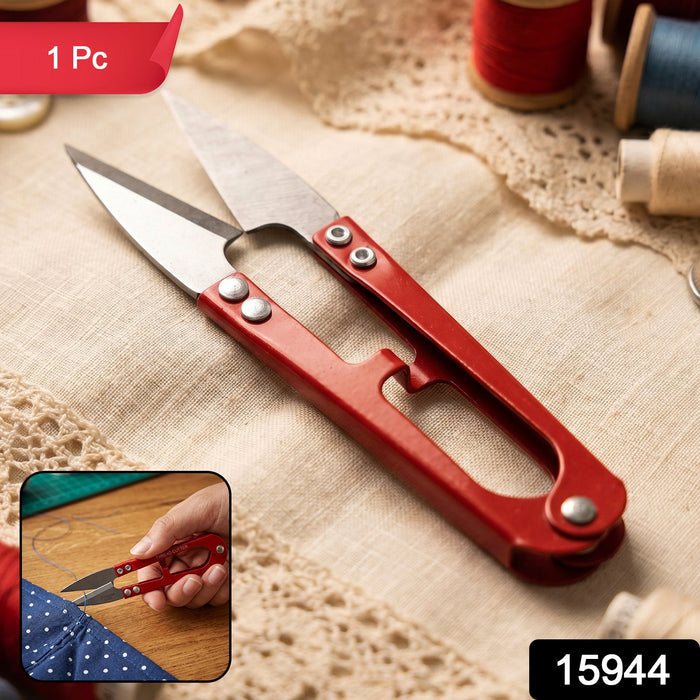 Thread cutter scissors trimming fabric in sewing and crafting