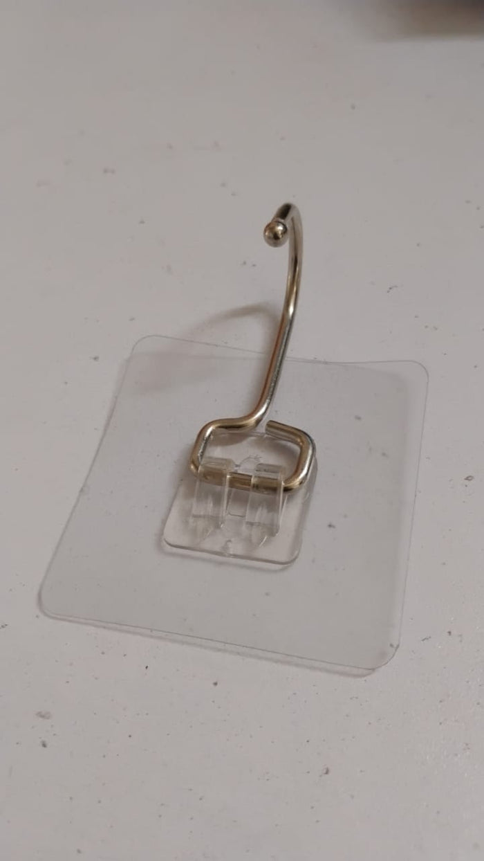 SteadyClear transparent adhesive wall hook holding towels and keys